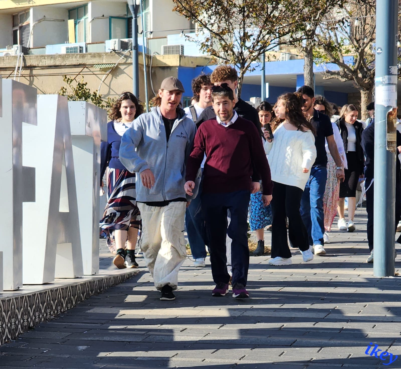 Akiva participants walking together on a sunny city street
