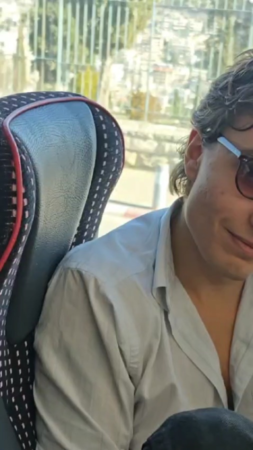 An Akiva participant relaxing during a bus ride